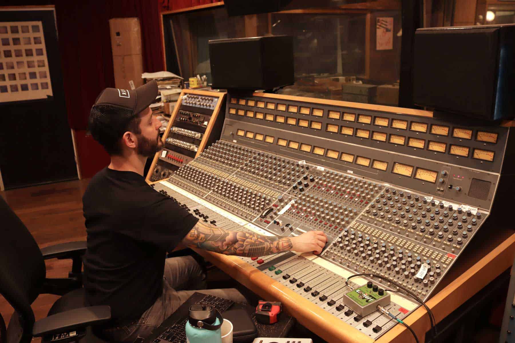 Jacob Light behind the Neve console at Survivor Sound Studios, November 2022